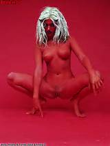 Hot Naked Blonde Girl Painted In Red And Wearing Horns Of The Devil