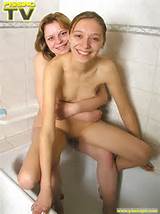 Two naked cute teen lesbians strip in a bath then take a simultaneous ...