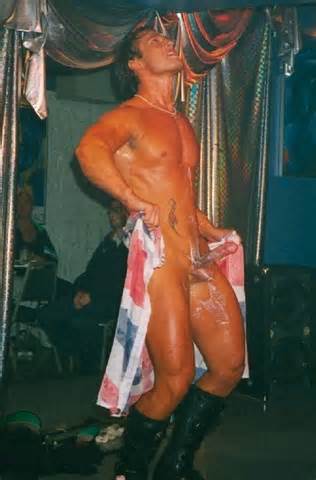 ... male stripper Double Impact performs nude strip tease in gay bar